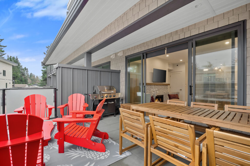 Premiere townhouse patio with dining area, fire bowl, views, and a BBQ