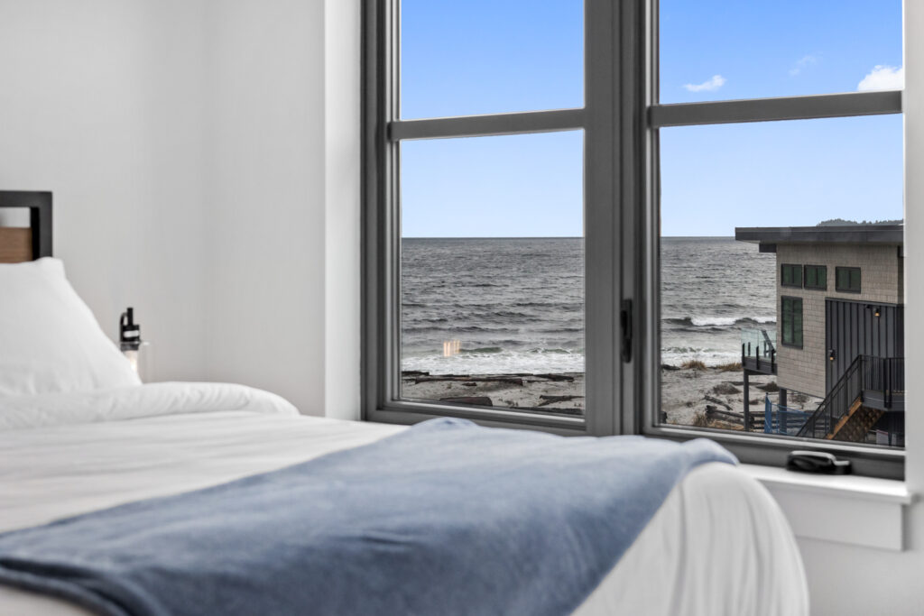Premiere townhouse primary suite with king bed and expansive ocean views